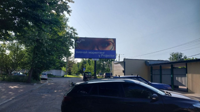 Білборд/Щит, Житомир, Миру просп., 37 (Мікрорайон ДОС, АТБ, аптека "Первоцвіт-Фарм", ПРОДМАРКЕТ "Проспект", ОщадБанк), в напрямку з центра міста
