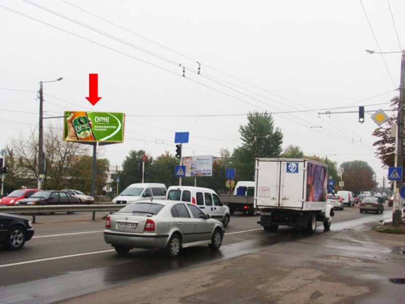 Білборд/Щит, Житомир, Незалежності пр. (кол. Ватутіна вул.) / Отаманів Соколовських вул. (кол. Потапова вул.), в бік вокзалу, біля супермаркету "Екомаркет", на світлофорі