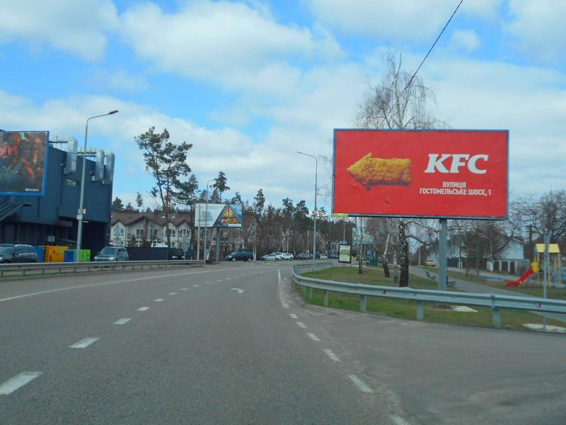 Білборд/Щит, Гостомель, м. Гостомель, вул. Свято-Покровська, 30А, перед ЖК "Чеський Двір", за 50м до автобусної зупинки ЖК "Чеський Двір", навпроти ЖК "Лісне"