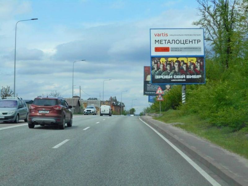 Білборд/Щит, Гостомель, смт. Гостомель, траса М-07 "Київ-Ковель", км 22+500 право, вул. Кулішова, 33, перед поворотом на с. Горенка, за 225м до автобусної зупинки "Горенка", низ