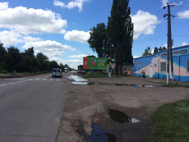 Білборд/Щит, Коростень, ул. Грушевского, 132, магазин завода лакокрасочных материалов "Янтарь", АЗС UPG, продмаркет "Завітай", из центра, в напр. выезда на Житомир