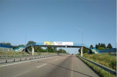 Реклама на мостах, Трассы, с. Біла Криниця,  на трасі категорії "1-Б" Київ – Чоп, зі сторони Рівного в напрямку м. Київ.