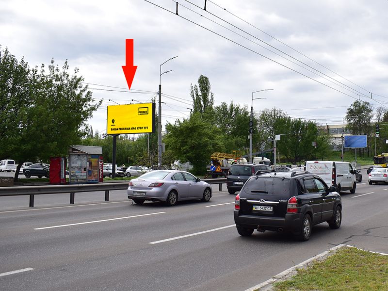 Білборд/Щит, Київ, Лугова вул. - Сім'ї Кульженків вул. (колиш. Дегтяренка вул.), біля ТРЦ "Караван", на світлофорі, в сторону вул. Автозаводська, вул. Вишгородська