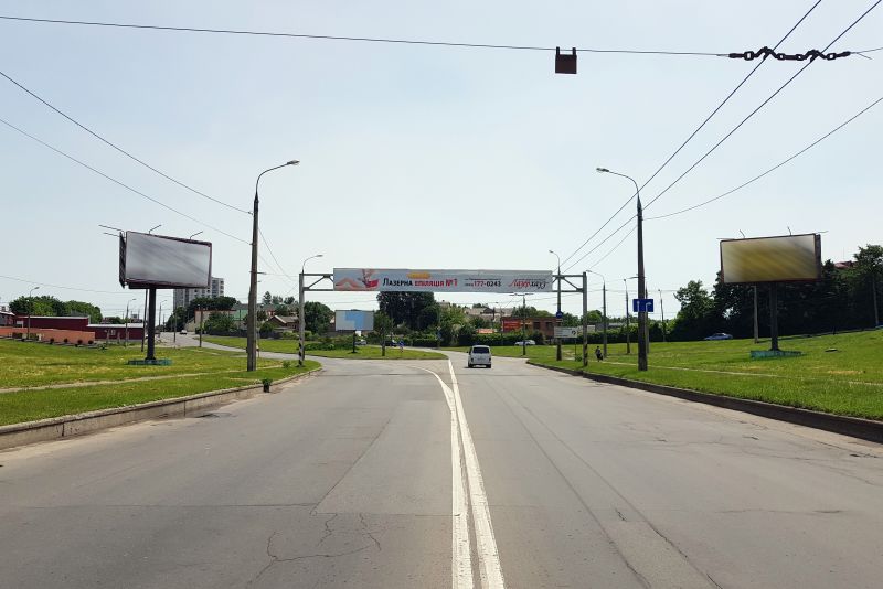 Арка/Реклама на мостах, Хмельницький, розв'язка вул.Кам'янецька - вул.Князя С.Хороброго - Львівське шосе. (зі сторони нового мосту) (в центр)